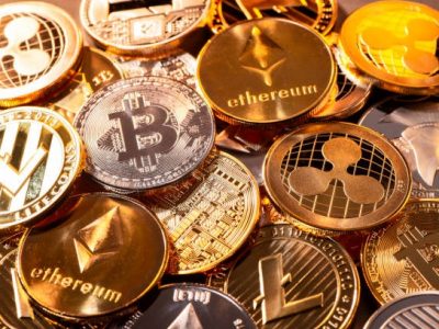 Frankfurt, Hesse, Germany - April 17, 2018: Many coins of various cryptocurrencies